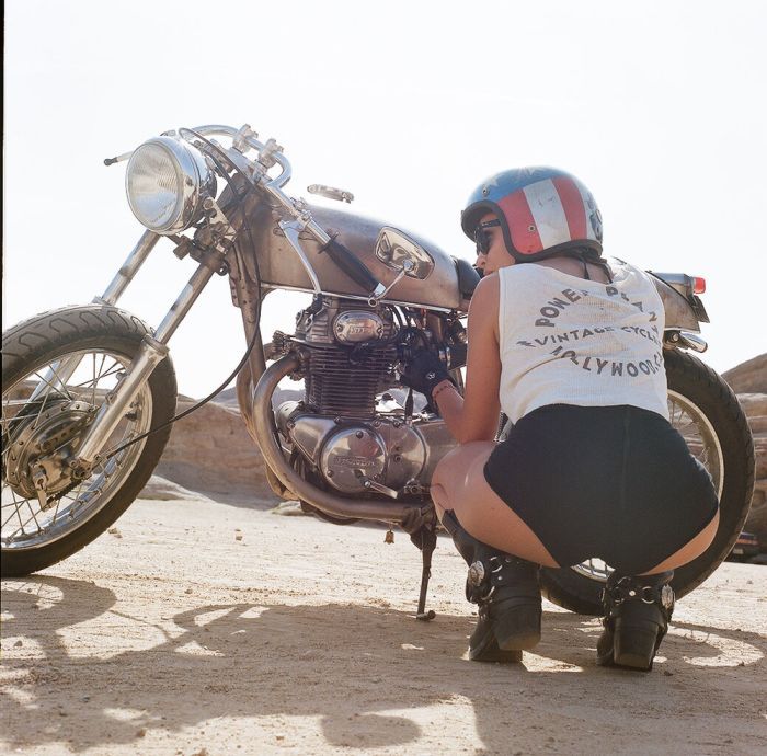 A playful frame from Girls on a motorcycle — online in Sydney